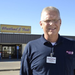 Mark Watkins, owner of Heartland Foods in Oakley, calls Midwest Energy 