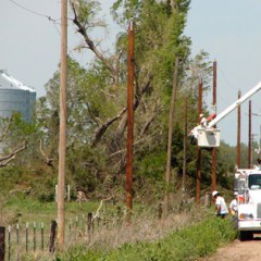 Midwest Energy crews replace poles near Rush Center that were damaged during a tornado April 14. A total of 526 poles and 24 miles of line were replaced as a result of the storm which produced 121 tornadoes throughout Kansas, Nebraska, Iowa, Oklahoma and Texas. No fatalities were reported in Kansas, though six were killed in Woodward, Okla.